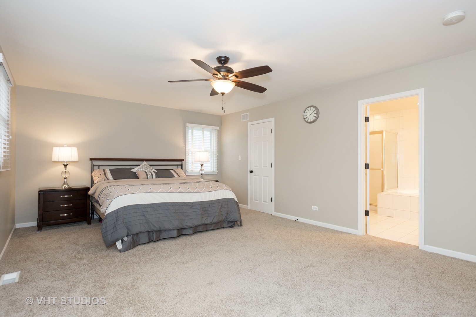 2112 Wicklow Road Naperville, IL 60564 - Photo 9 of 17 a spacious bedroom with a bed and a chandelier