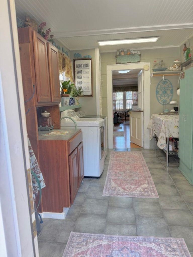 829 North Perkins Road Memphis, TN 38122 - Photo 10 of 36 Laundry room featuring cabinet space and washing machine and dryer