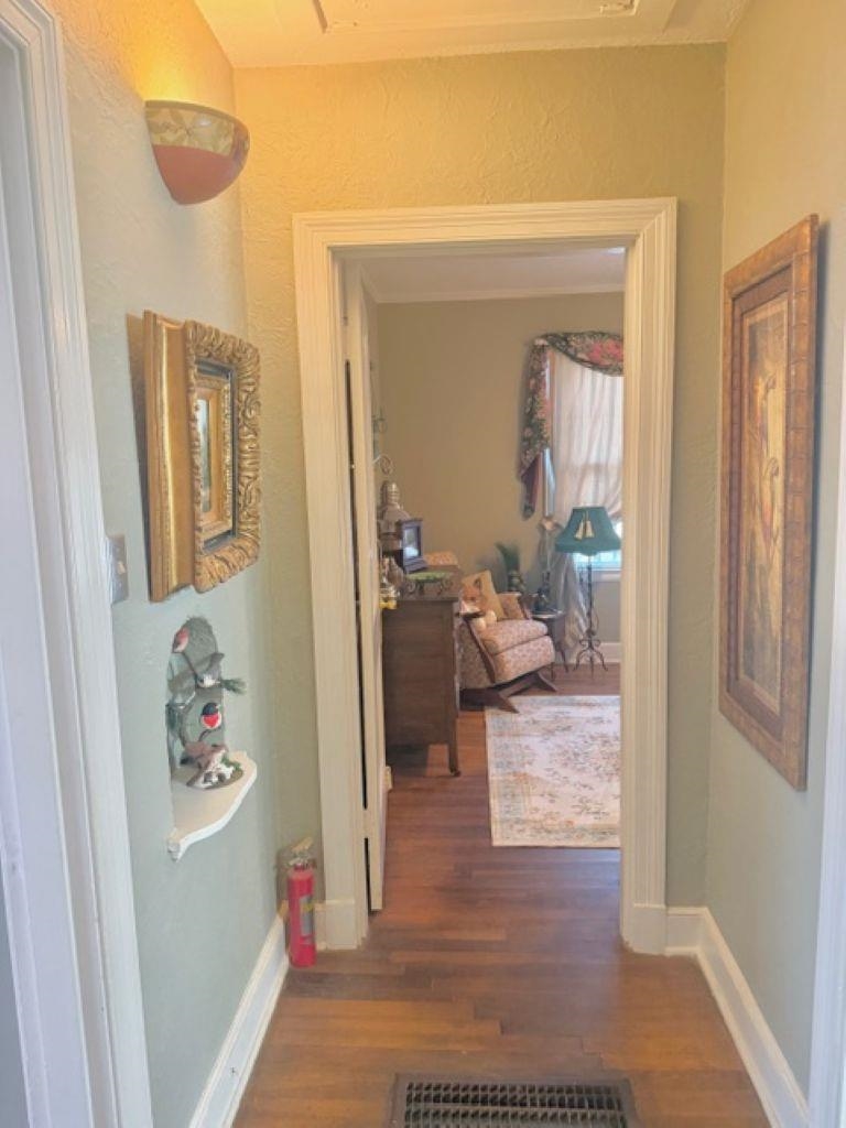 829 North Perkins Road Memphis, TN 38122 - Photo 16 of 36 Hallway featuring dark wood-type flooring and a textured wall