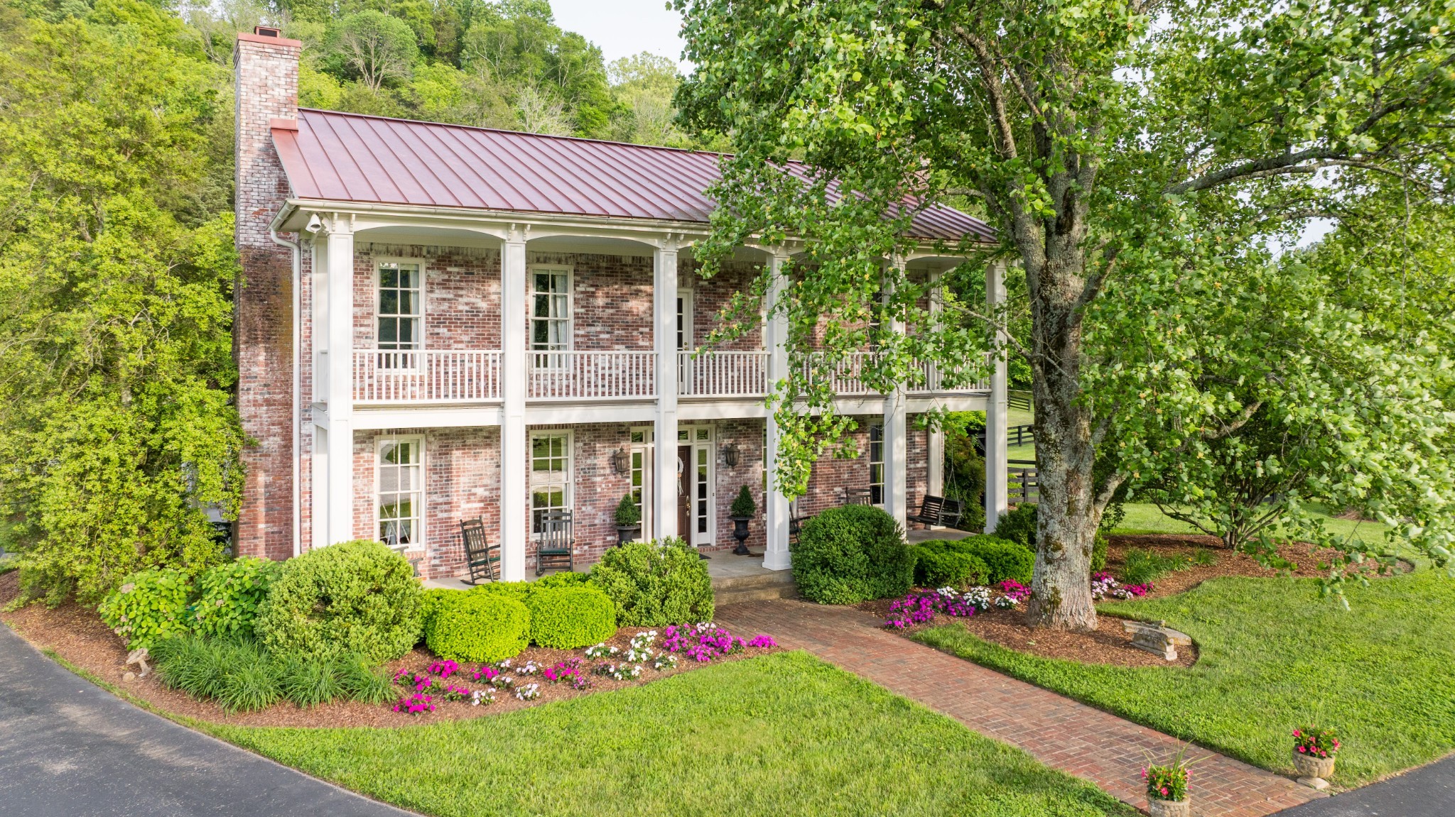 5620 Leipers Creek Road Franklin, TN 37064 - Photo 2 of 74 a front view of a house with a yard garden and outdoor seating