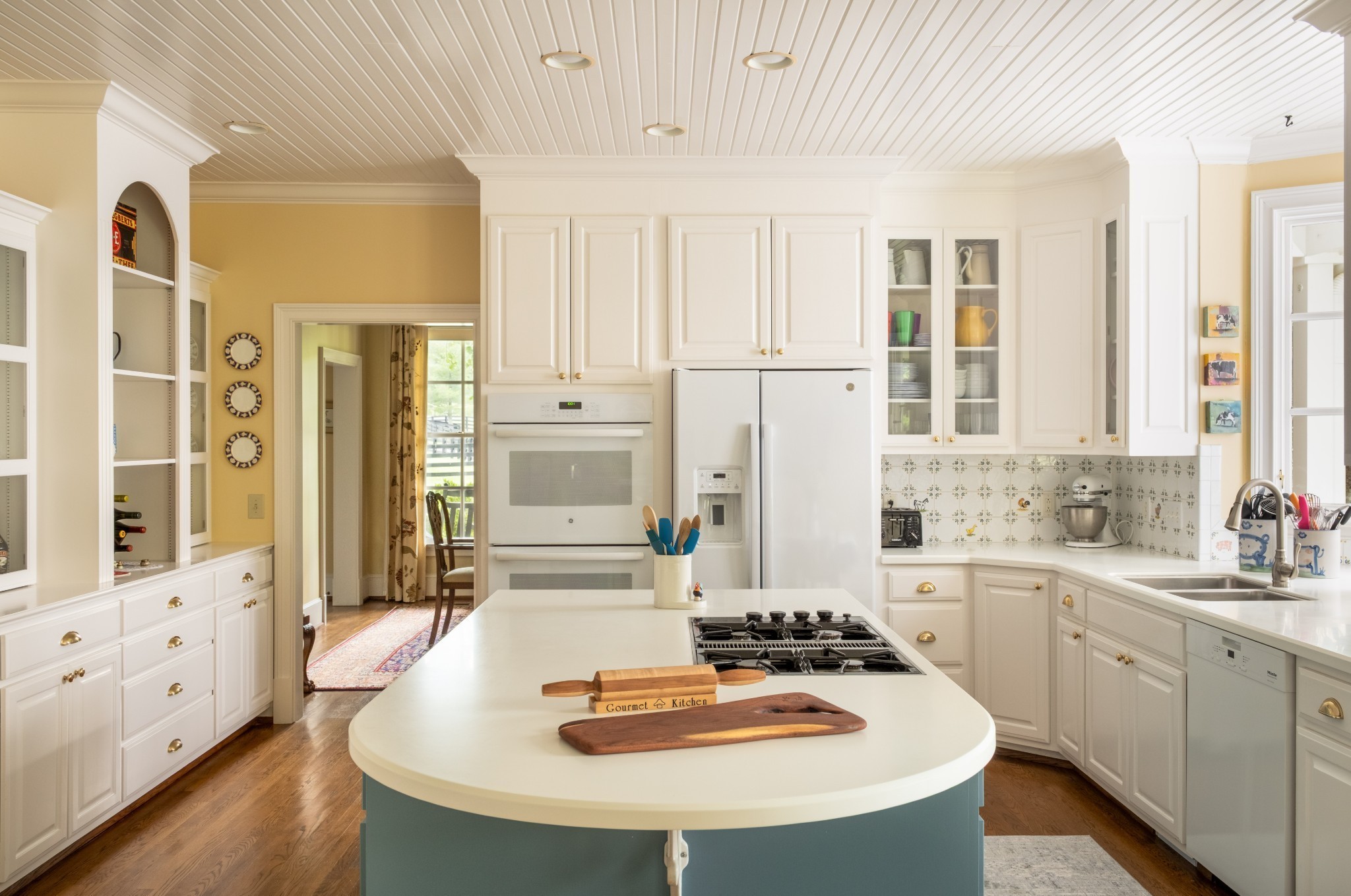 5620 Leipers Creek Road Franklin, TN 37064 - Photo 40 of 74 a kitchen with stainless steel appliances kitchen island granite countertop a sink a stove and white cabinets