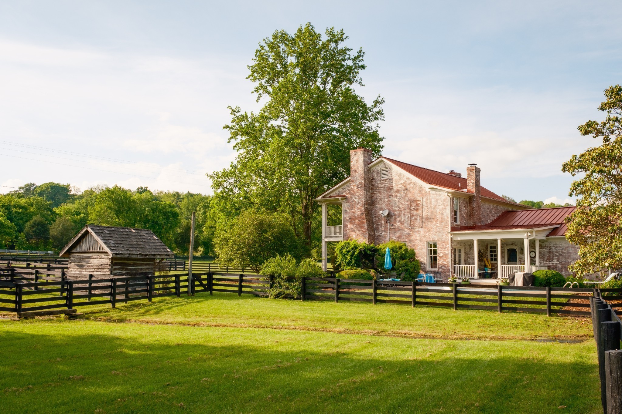 5620 Leipers Creek Road Franklin, TN 37064 - Photo 58 of 74 a view of a swimming pool with lawn chairs and large trees