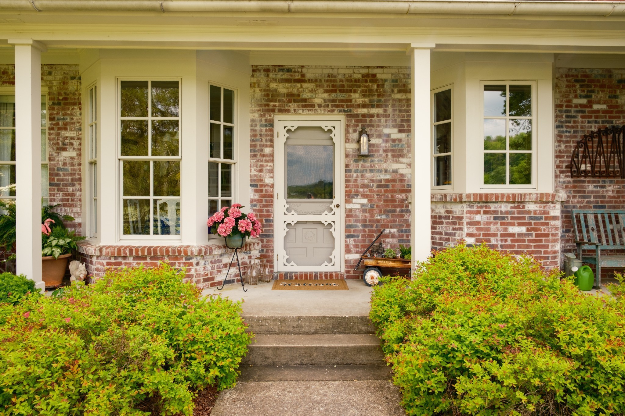 5620 Leipers Creek Road Franklin, TN 37064 - Photo 60 of 74 a front view of a house with a large window and potted plants