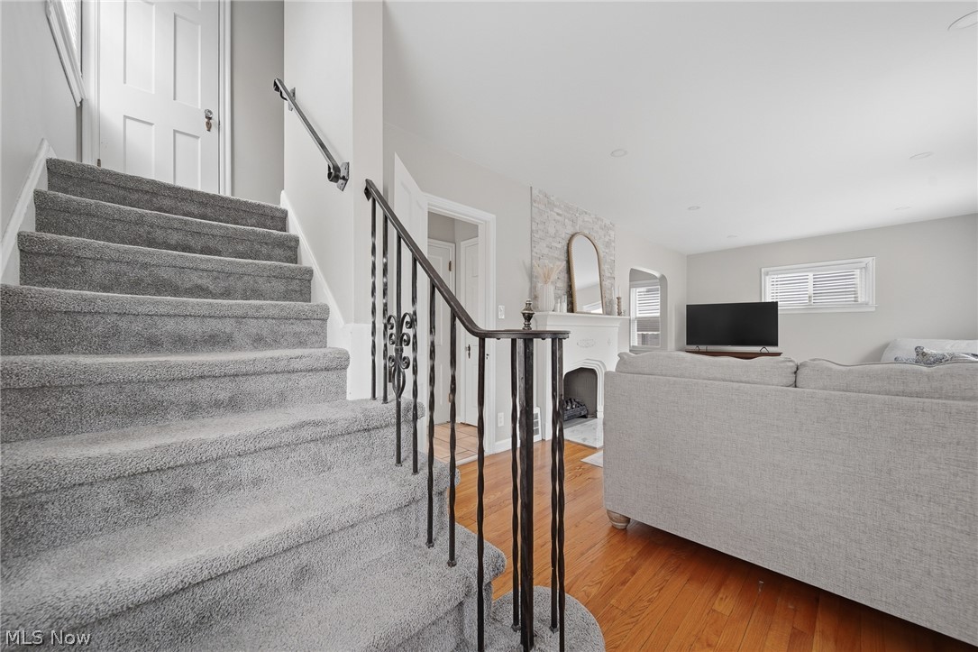 2231 Brockway Road University Heights, OH 44118 - Photo 4 of 46 Carpeted staircase with an ornamental wrought iron railing