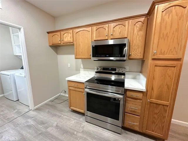 a kitchen with a stove and a microwave