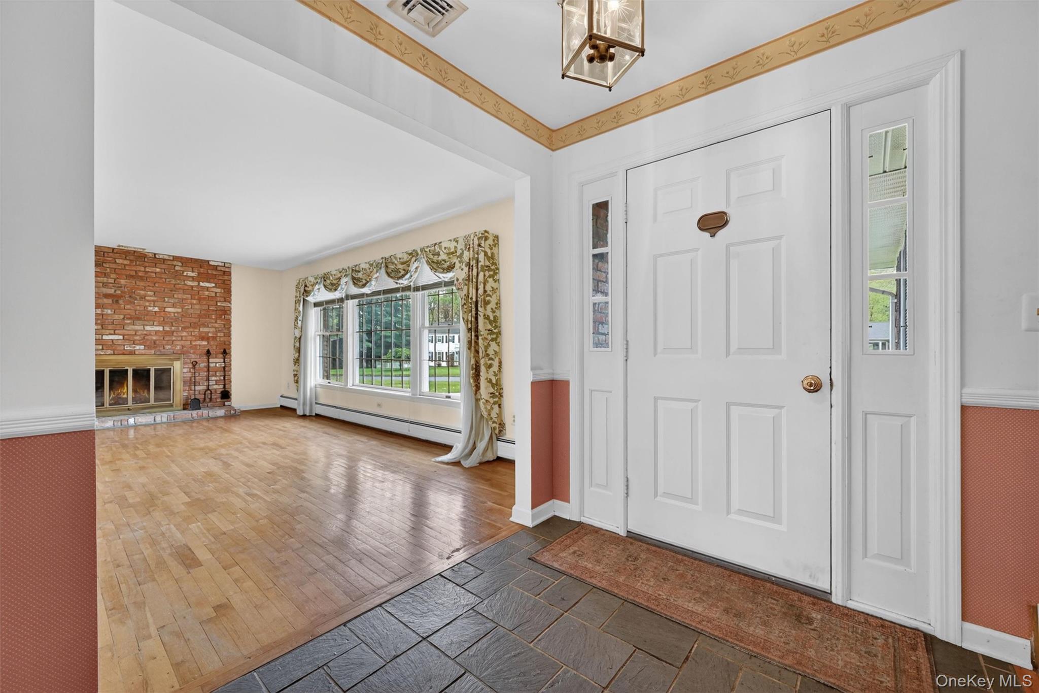 16 Ridgeview Terrace Goshen, NY 10924 - Photo 3 of 35 Entryway with a paneled door, sidelight windows, and slate tile flooring
