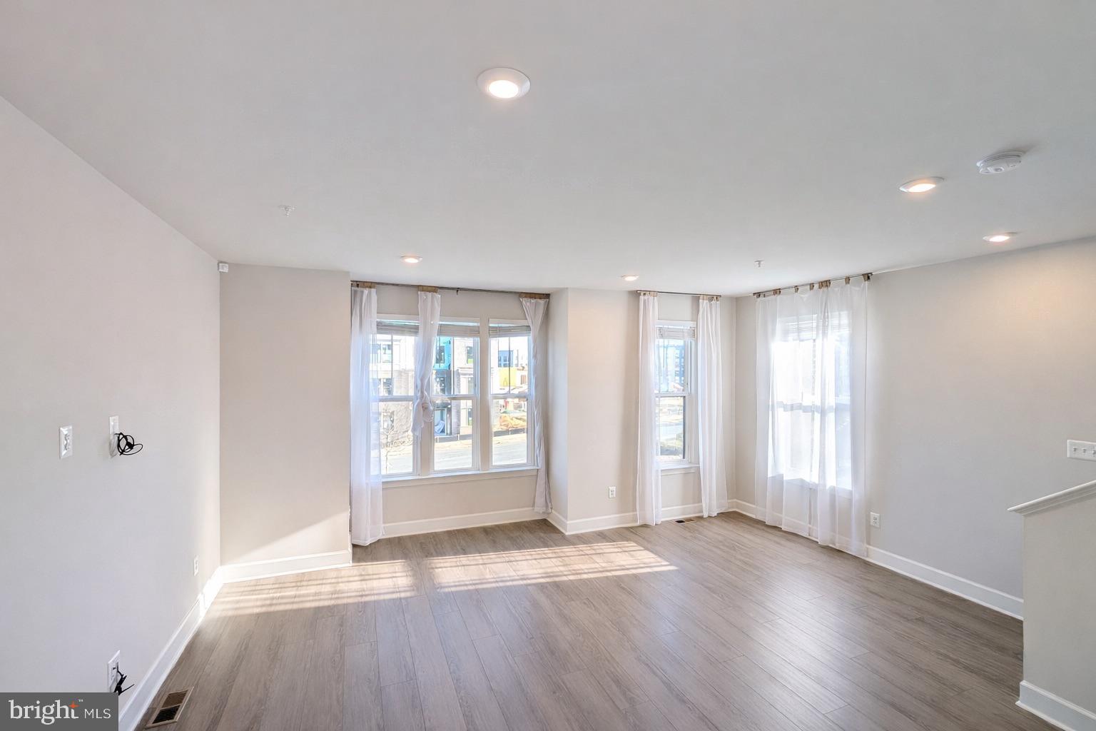6710 Belcrest Road Hyattsville, MD 20782 - Photo 2 of 22 Natural light flows in the bright living-area.
