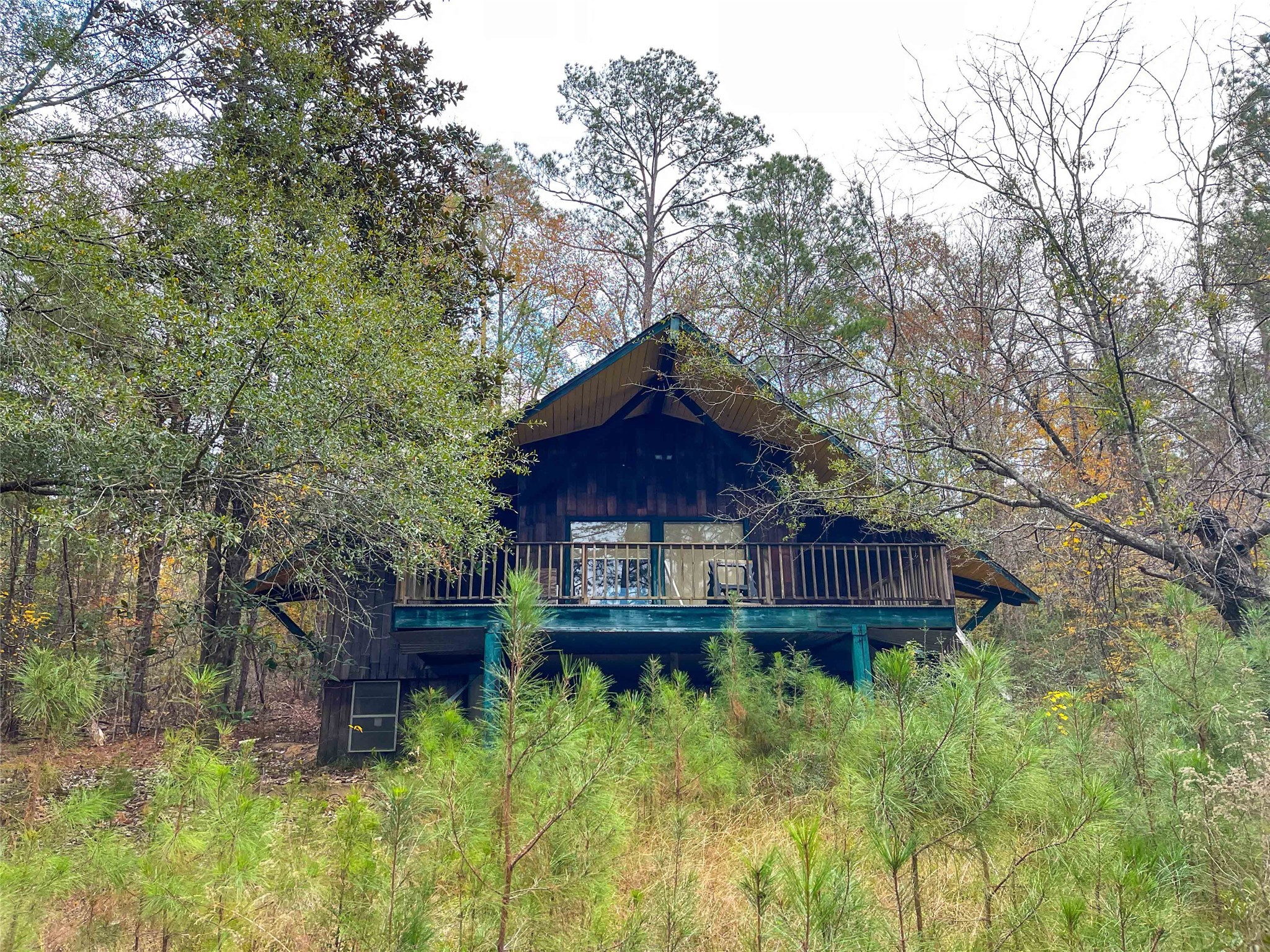 0 Pvt Road Newton, TX 75966 - Photo 1 of 26 a wooden bench sitting in front of a house
