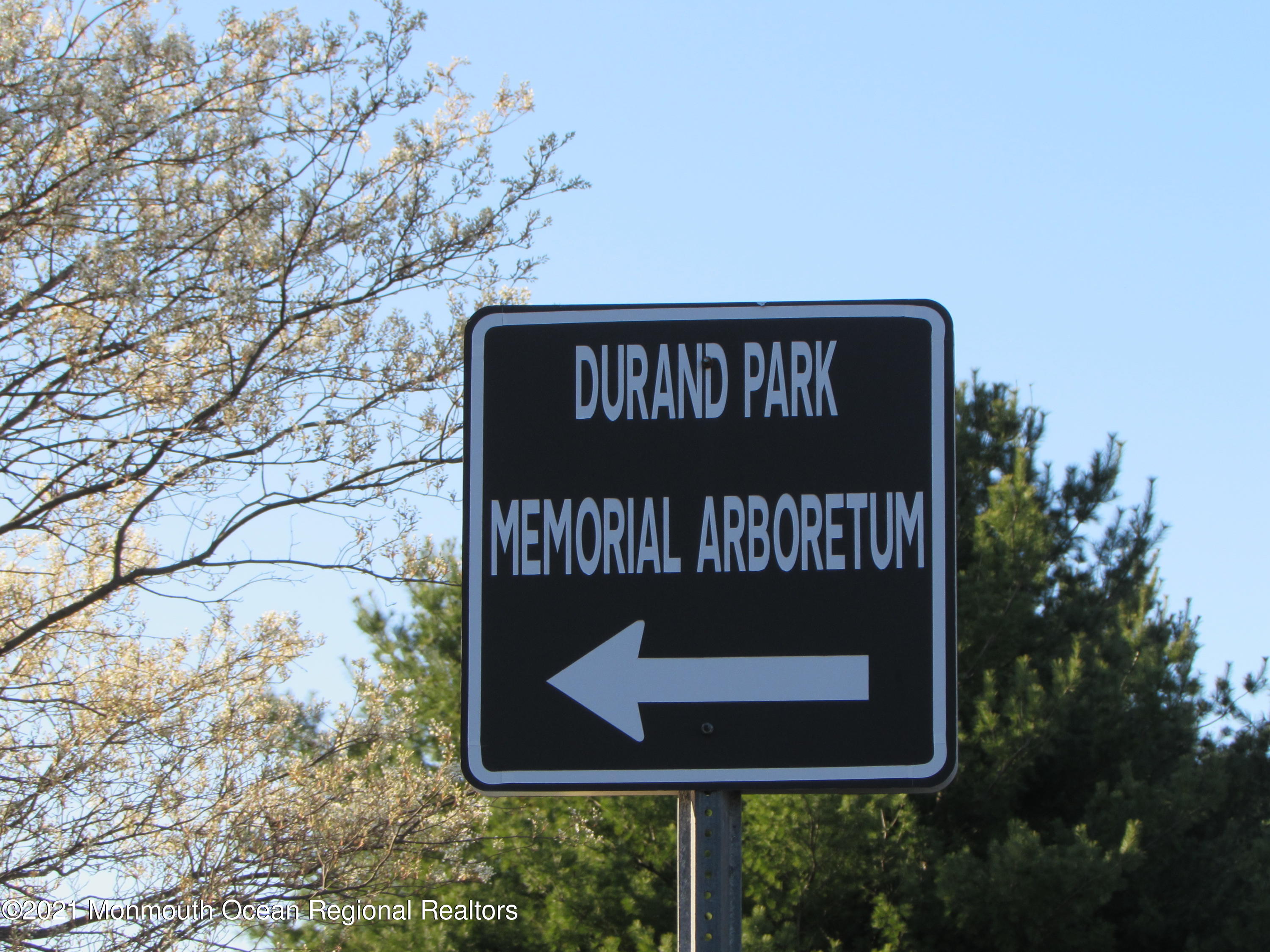 15 Homestead Road Freehold, NJ 07728 - Photo 50 of 54 a sign on the side of a road