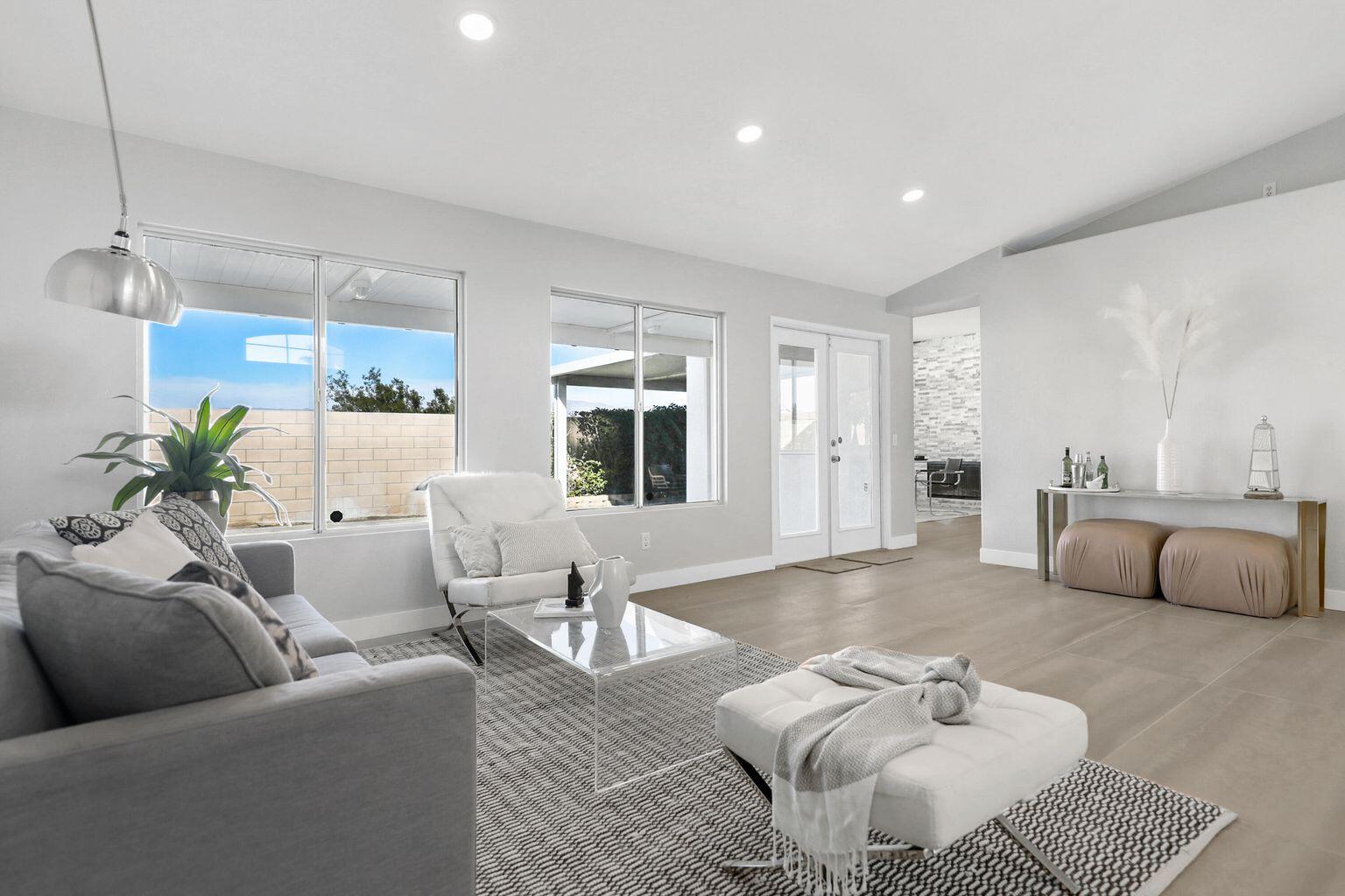 Undisclosed Address Palm Desert, CA 92211 - Photo 6 of 31 a living room with furniture and a couch