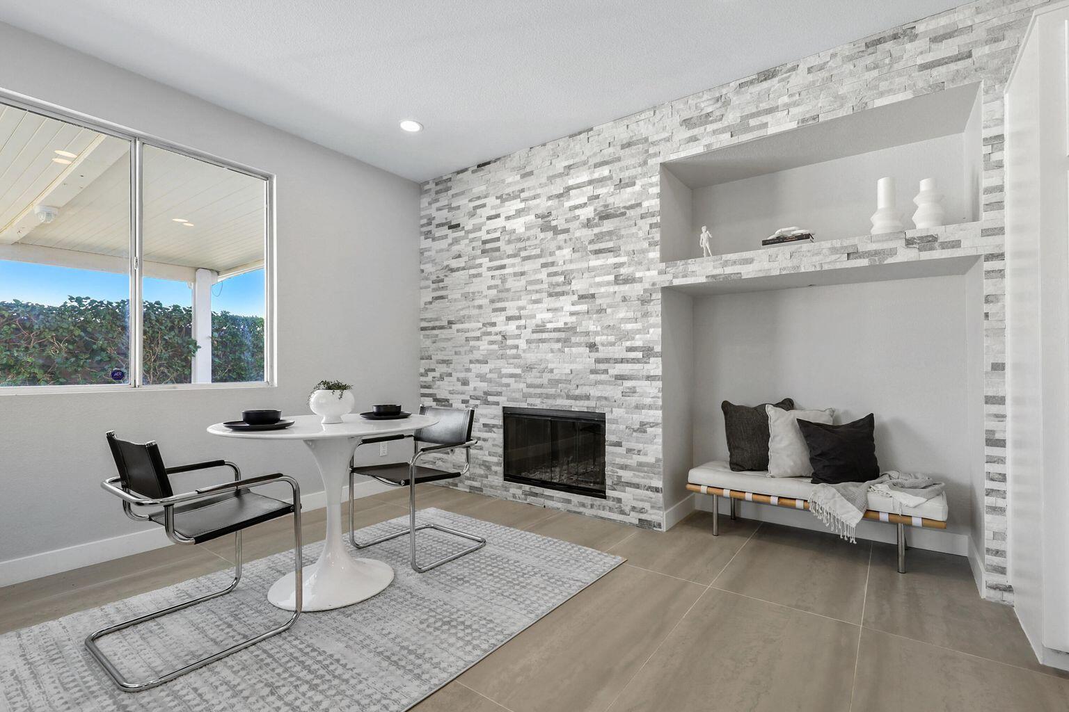 Undisclosed Address Palm Desert, CA 92211 - Photo 8 of 31 a living room with furniture and a fireplace