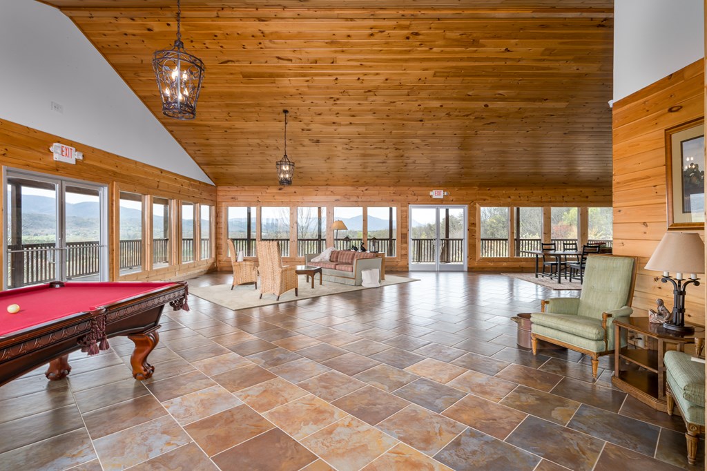 540 Plemons Road Chatsworth, GA 30705 - Photo 46 of 62 a gym with pool table and outdoor seating