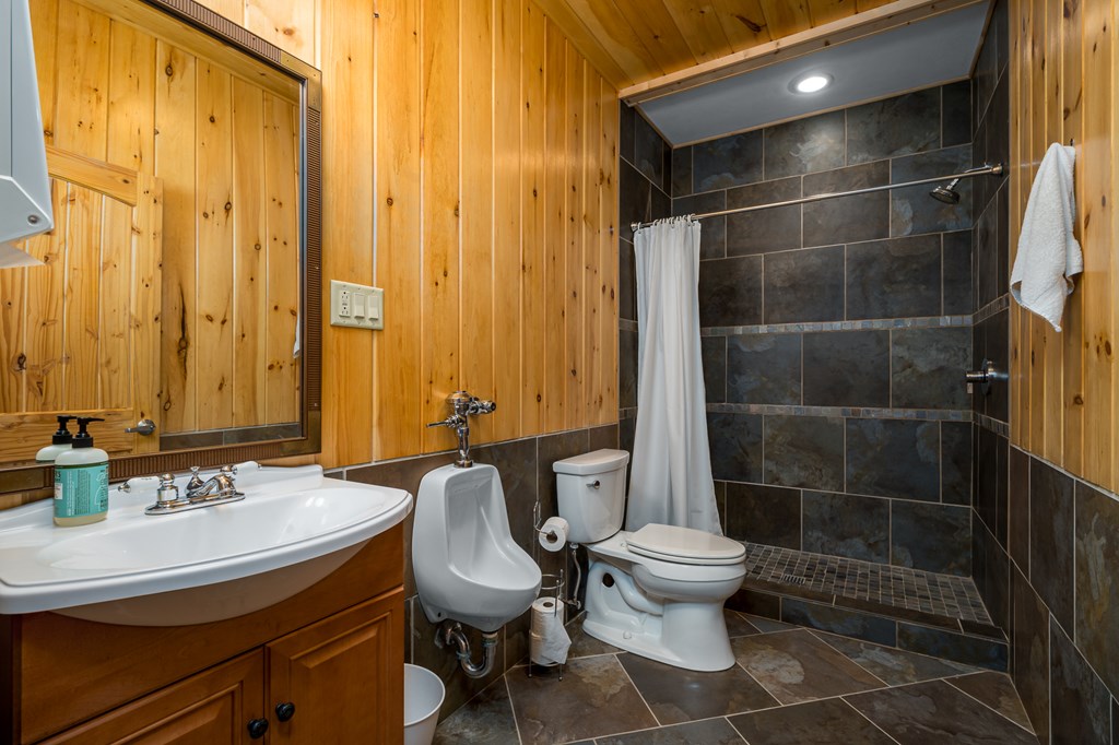 540 Plemons Road Chatsworth, GA 30705 - Photo 56 of 62 a bathroom with a sink toilet and shower
