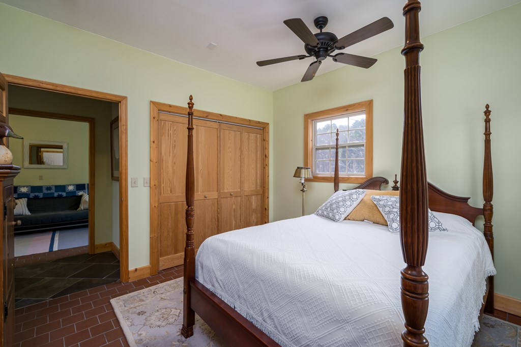 540 Plemons Road Chatsworth, GA 30705 - Photo 59 of 62 a bedroom with a bed and a view of living room