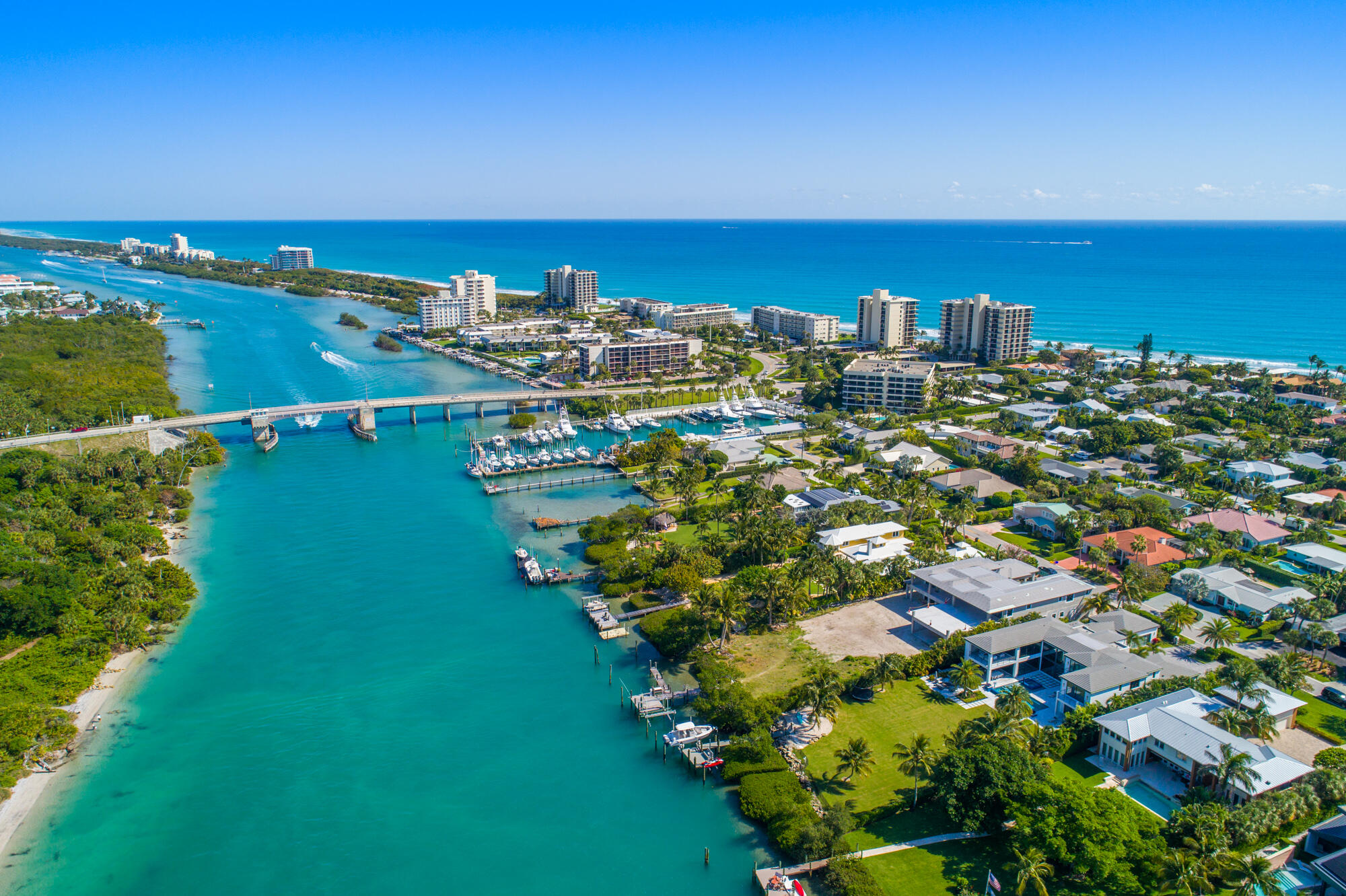 102 Lighthouse Drive Jupiter Inlet Colony, FL 33469 - Photo 13 of 18 a view of a city with lots of residential buildings ocean and mountain view in back