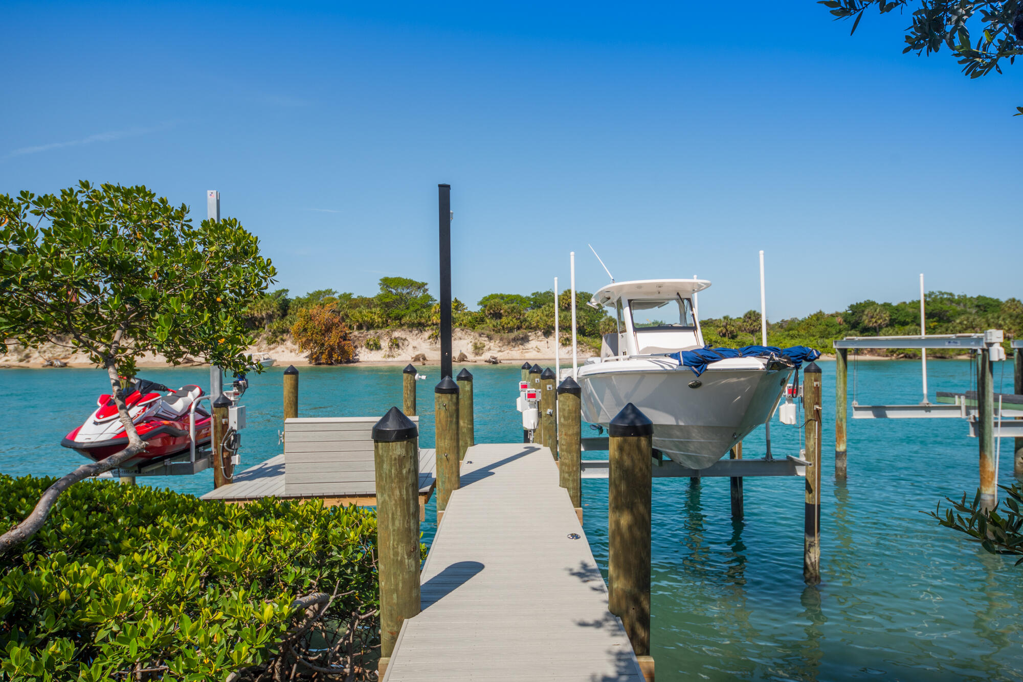 102 Lighthouse Drive Jupiter Inlet Colony, FL 33469 - Photo 4 of 18 a view of a lake with a sitting space