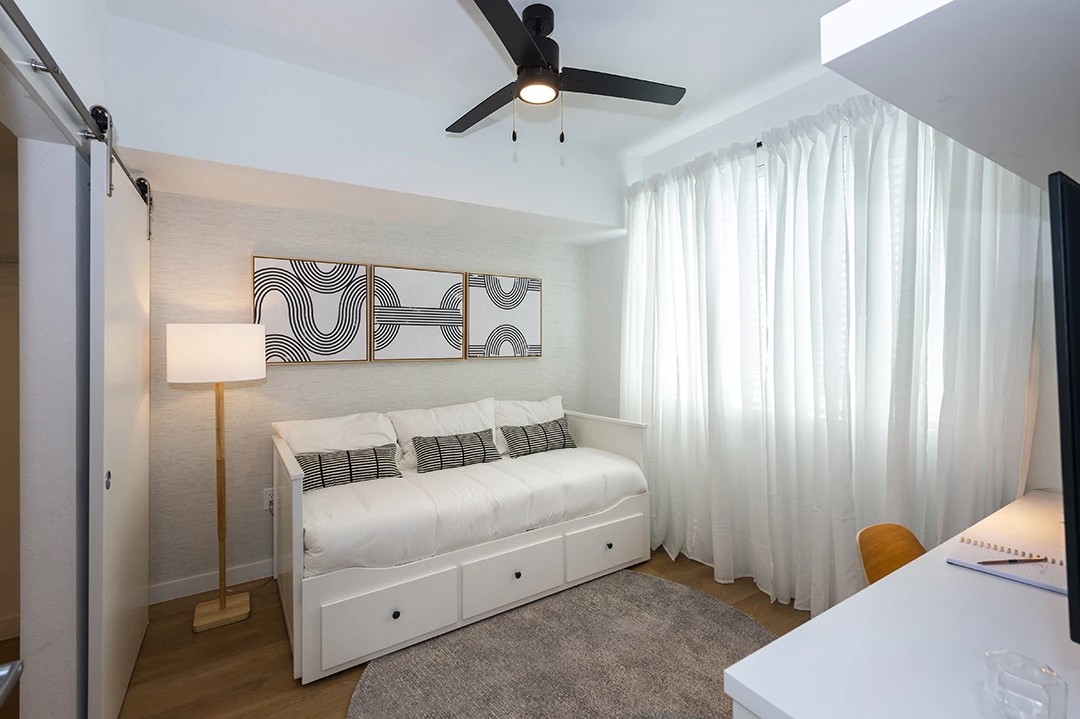 18036 Park Row Drive, Unit 3103 Houston, TX 77084 - Photo 13 of 20 a bedroom with a bed and a chandelier