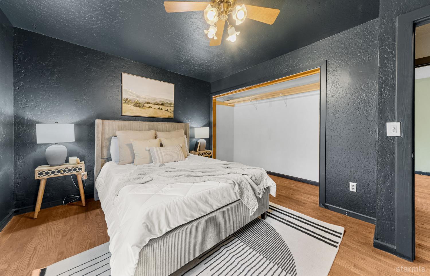 712 Seneca Drive South Lake Tahoe, CA 96150 - Photo 11 of 28 a bedroom with a bed and a lamp