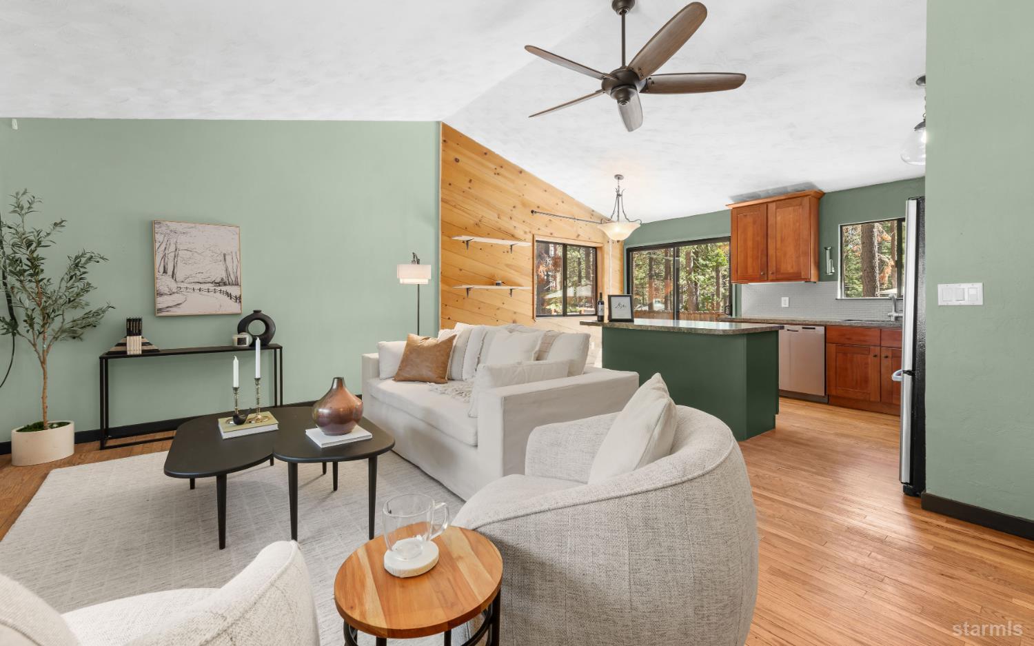 712 Seneca Drive South Lake Tahoe, CA 96150 - Photo 3 of 28 a living room with furniture and a wooden floor
