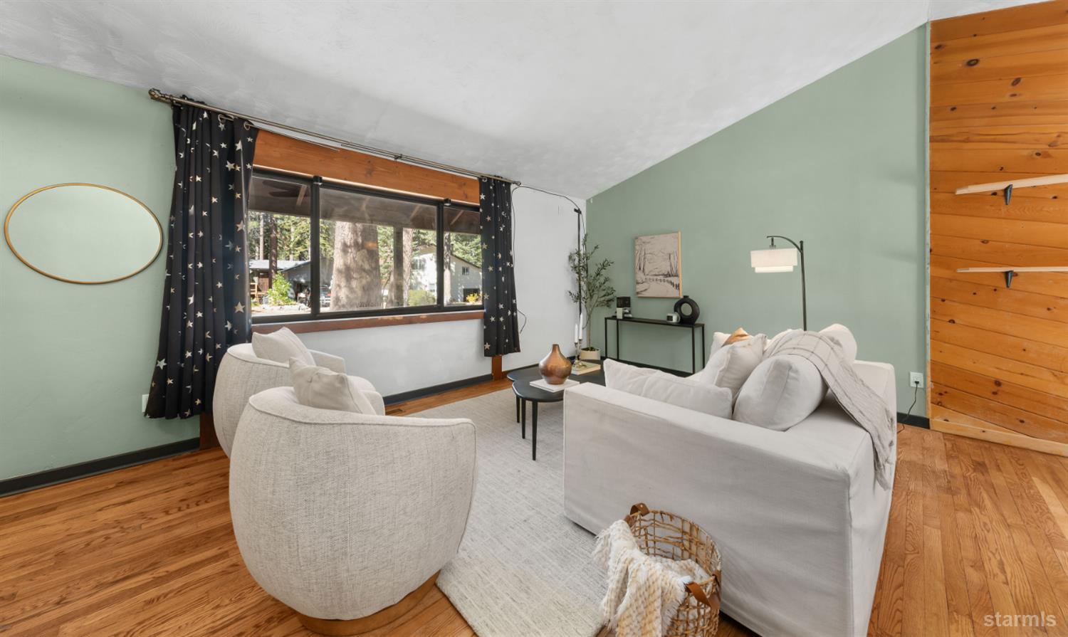 712 Seneca Drive South Lake Tahoe, CA 96150 - Photo 4 of 28 a living room with furniture a table and wooden floor