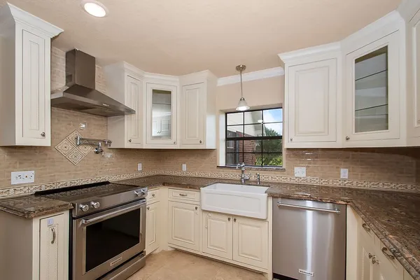 a kitchen with a stove and a microwave