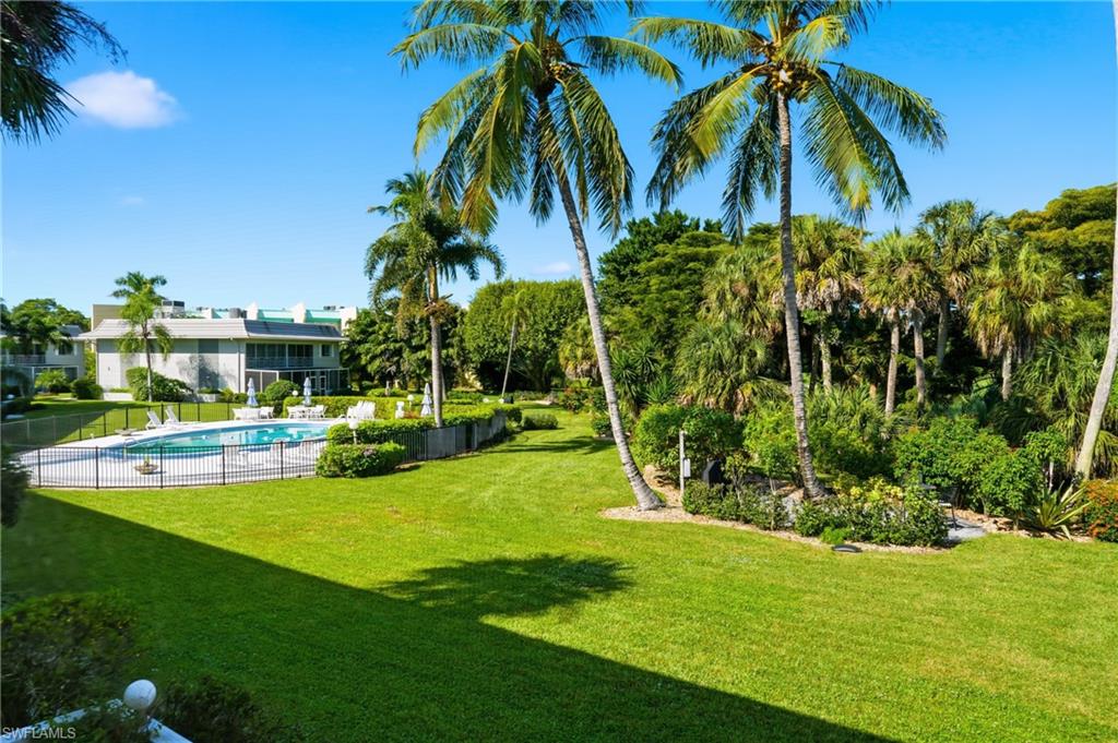 215 Cypress Way East, Unit D8 Naples, FL 34110 - Photo 15 of 20 View of yard with a patio