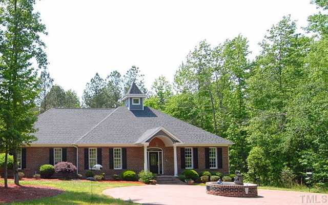 1667 Hayes Road Creedmoor, NC 27522 - Photo 1 of 12 Beautiful brick home with side entry over-sized 2 car garage & extras over sized detached garage = enough for 4 cars, boat, shop, hobbies and more * Brick circular drive for guest & covered entry * 3.5 Acres * No subdivision restrictions! Facade/Exterior Front