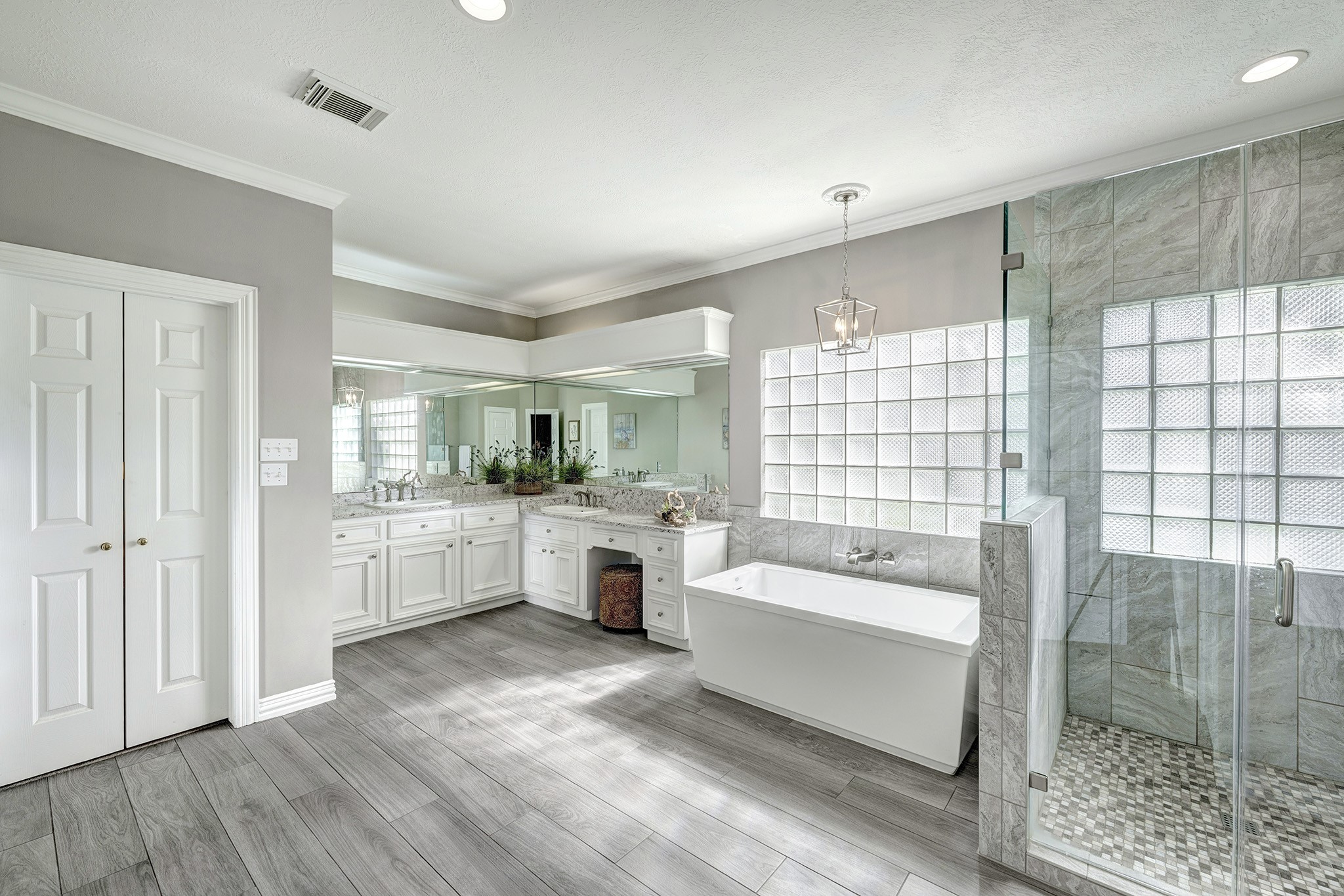 5302 Mahogany Creek Court Spring, TX 77379 - Photo 16 of 39 a bathroom with a tub a double vanity sink a mirror and shower