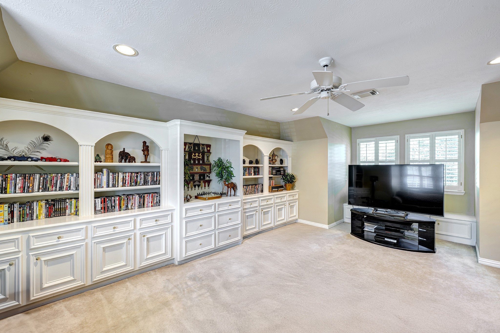 5302 Mahogany Creek Court Spring, TX 77379 - Photo 20 of 39 a living room with fireplace furniture and a flat screen tv