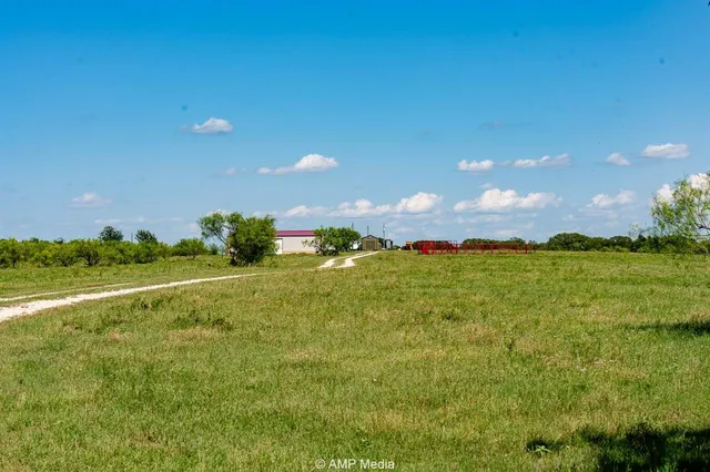 a view of a lake and yard