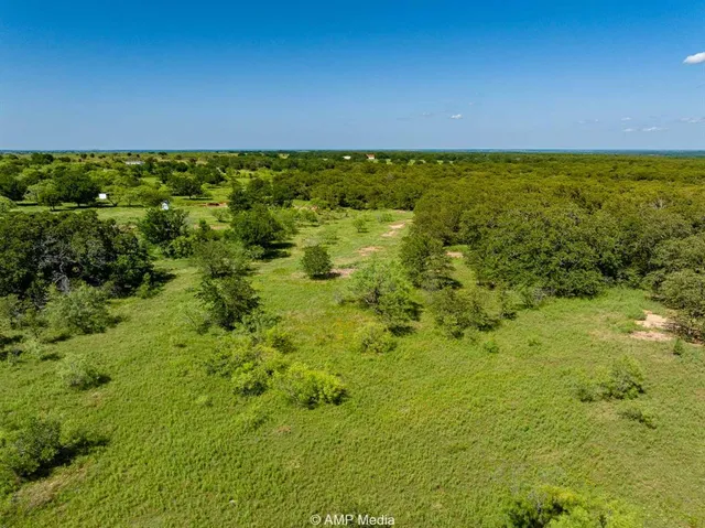 a view of a lake with a yard