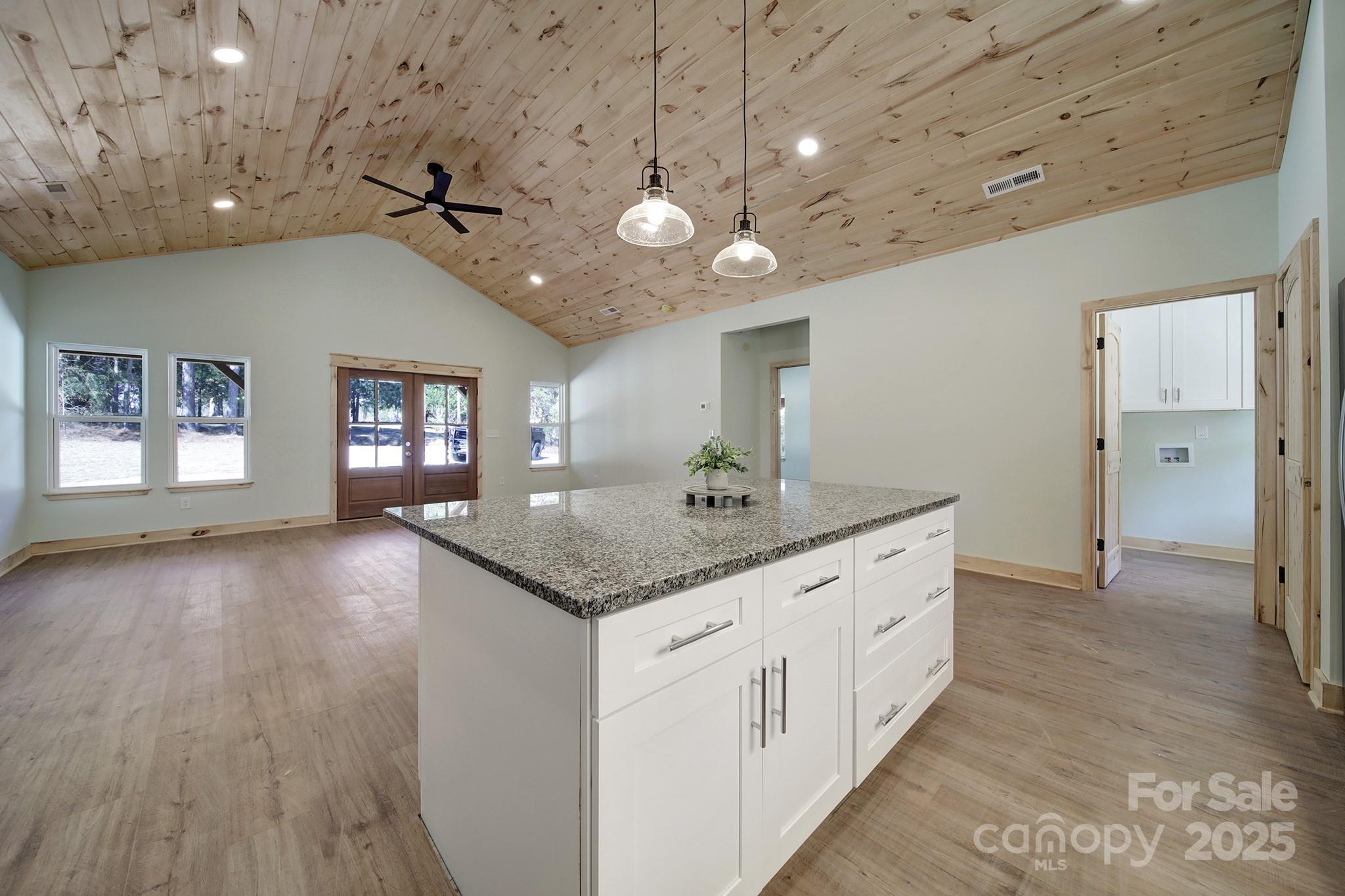 230 East Doc Garris Road Lancaster, SC 29720 - Photo 14 of 31 a bathroom with a granite countertop sink a large mirror and vanity