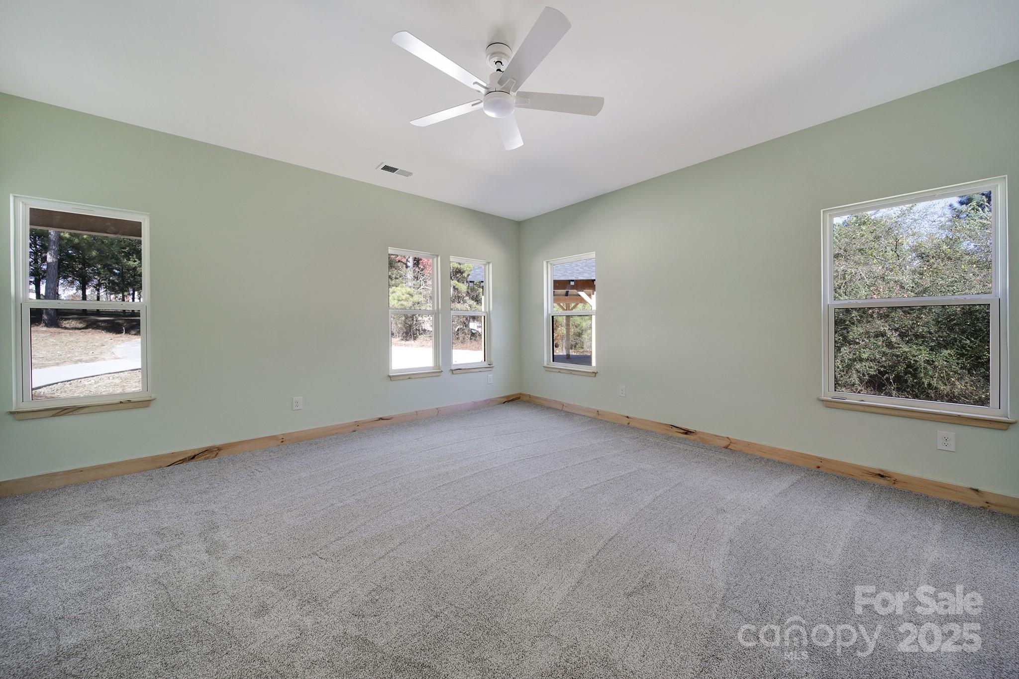 230 East Doc Garris Road Lancaster, SC 29720 - Photo 28 of 31 an empty room with windows and fan
