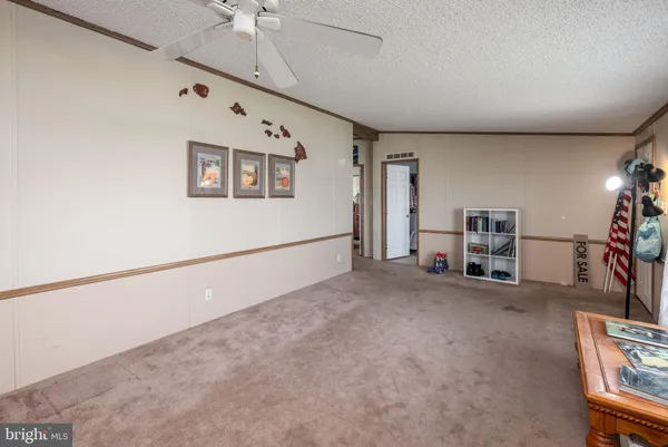 a view of a livingroom with furniture and a window