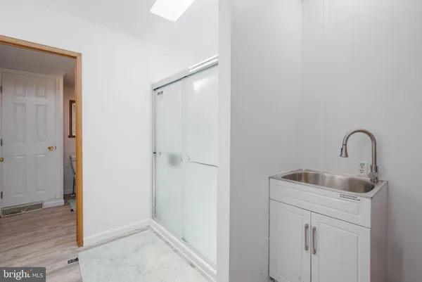a close view of a sink and utility room