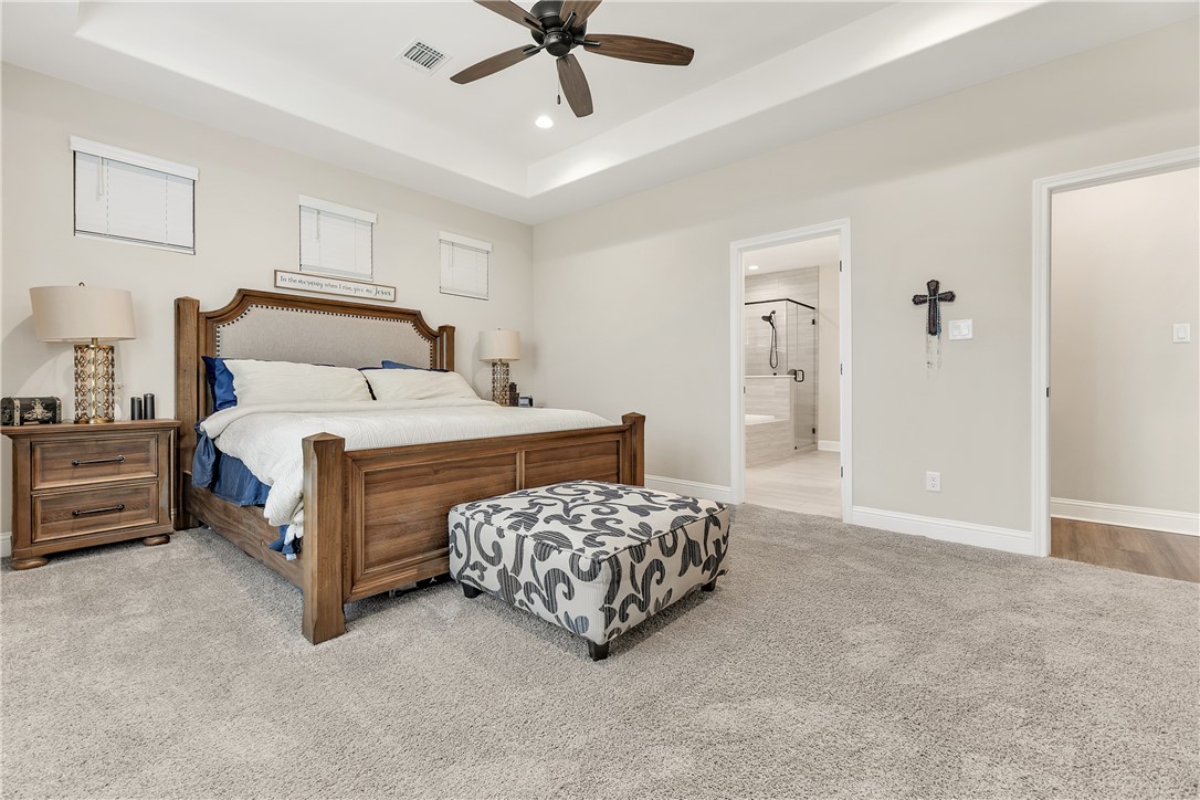 4355 Fox River Lane Bryan, TX 77802 - Photo 14 of 36 a bedroom with a bed and a cabinets