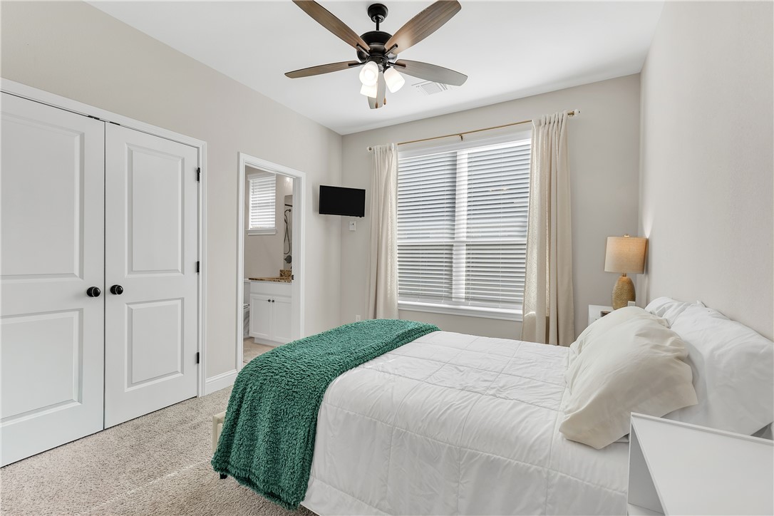 4355 Fox River Lane Bryan, TX 77802 - Photo 20 of 36 a bedroom with a bed and a window