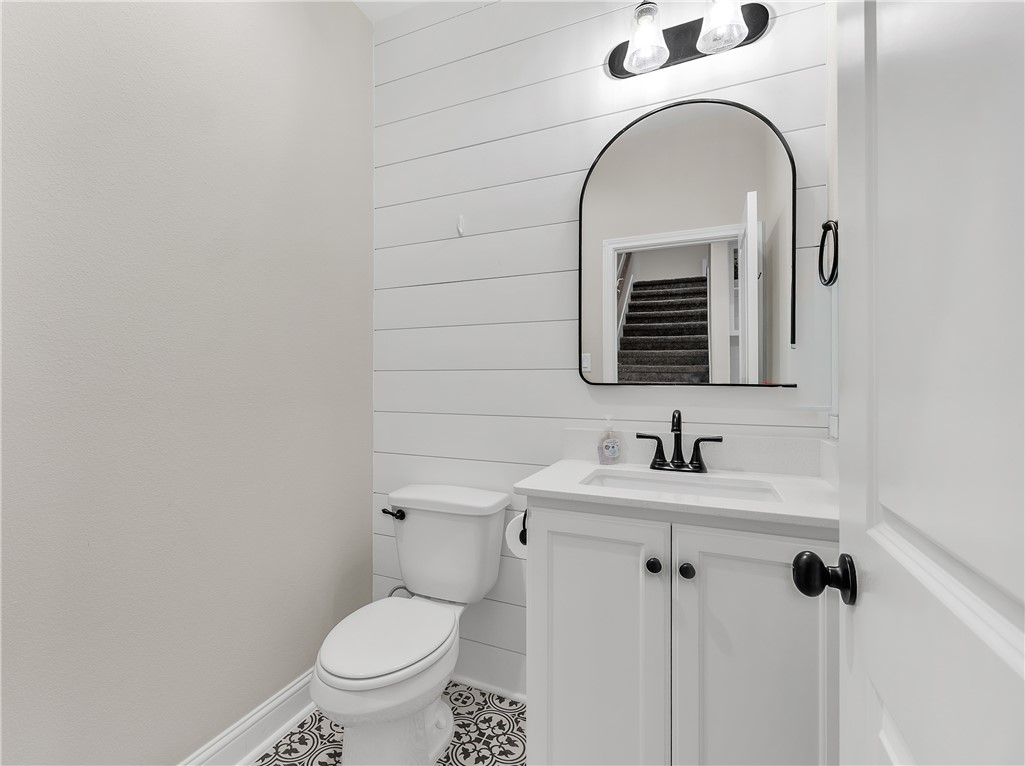 4355 Fox River Lane Bryan, TX 77802 - Photo 24 of 36 a bathroom with a toilet sink and mirror