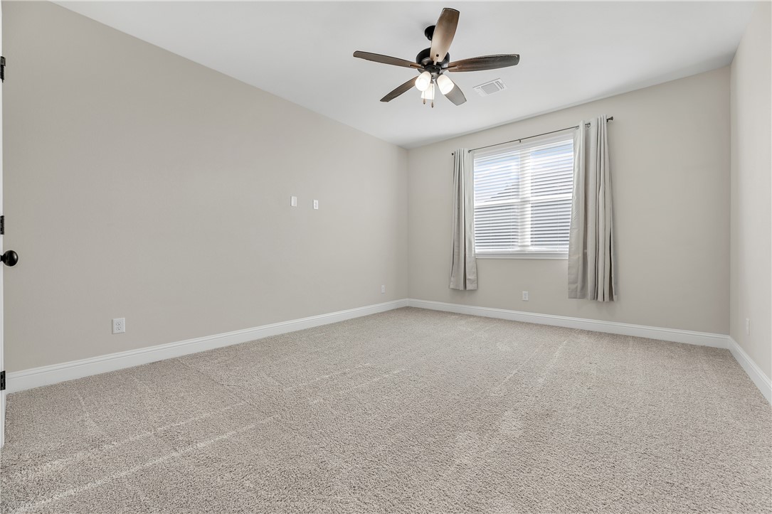 4355 Fox River Lane Bryan, TX 77802 - Photo 29 of 36 an empty room with a empty space and a ceiling fan