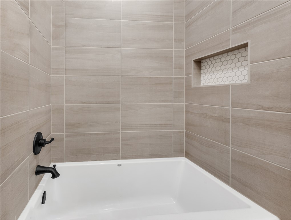 4355 Fox River Lane Bryan, TX 77802 - Photo 32 of 36 a bathroom with a bathtub