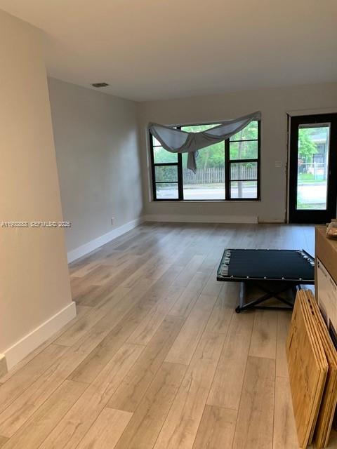 2 Northeast 44th Street Miami, FL 33137 - Photo 16 of 25 wooden floor with a sink and a window