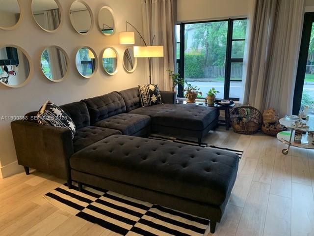 2 Northeast 44th Street Miami, FL 33137 - Photo 4 of 25 a living room with furniture and a window