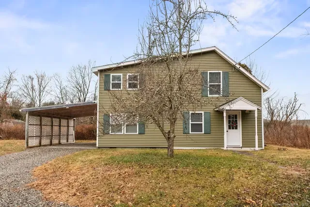 front view of a house with a yard