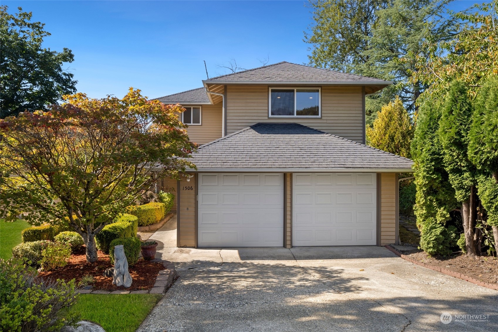1506 227th Place Southwest Bothell, WA 98021 - Photo 1 of 25 a front view of a house with a yard and garage