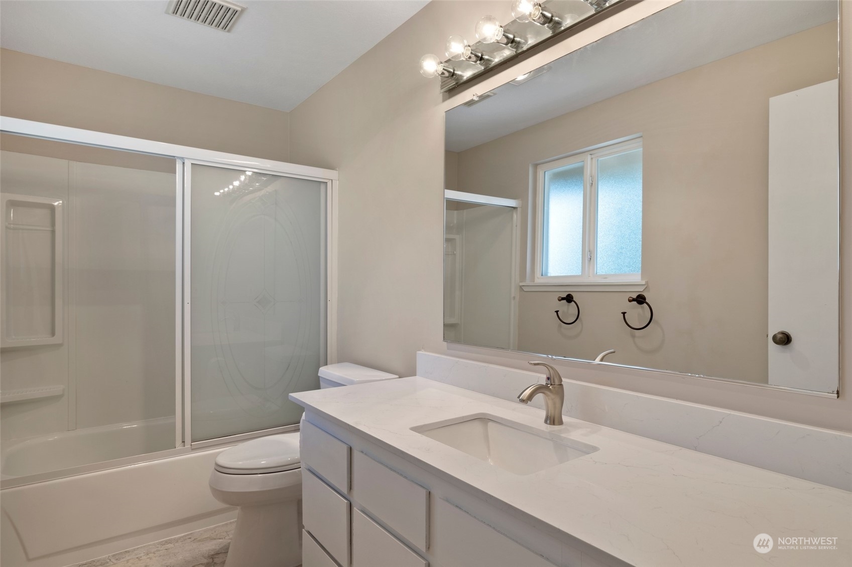 1506 227th Place Southwest Bothell, WA 98021 - Photo 15 of 25 a bathroom with a sink a toilet and shower