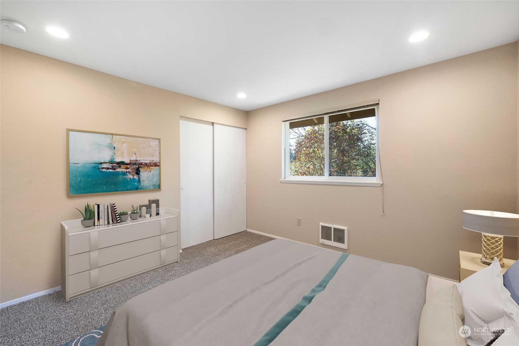 1506 227th Place Southwest Bothell, WA 98021 - Photo 17 of 25 a bedroom with a bed a couch and a window