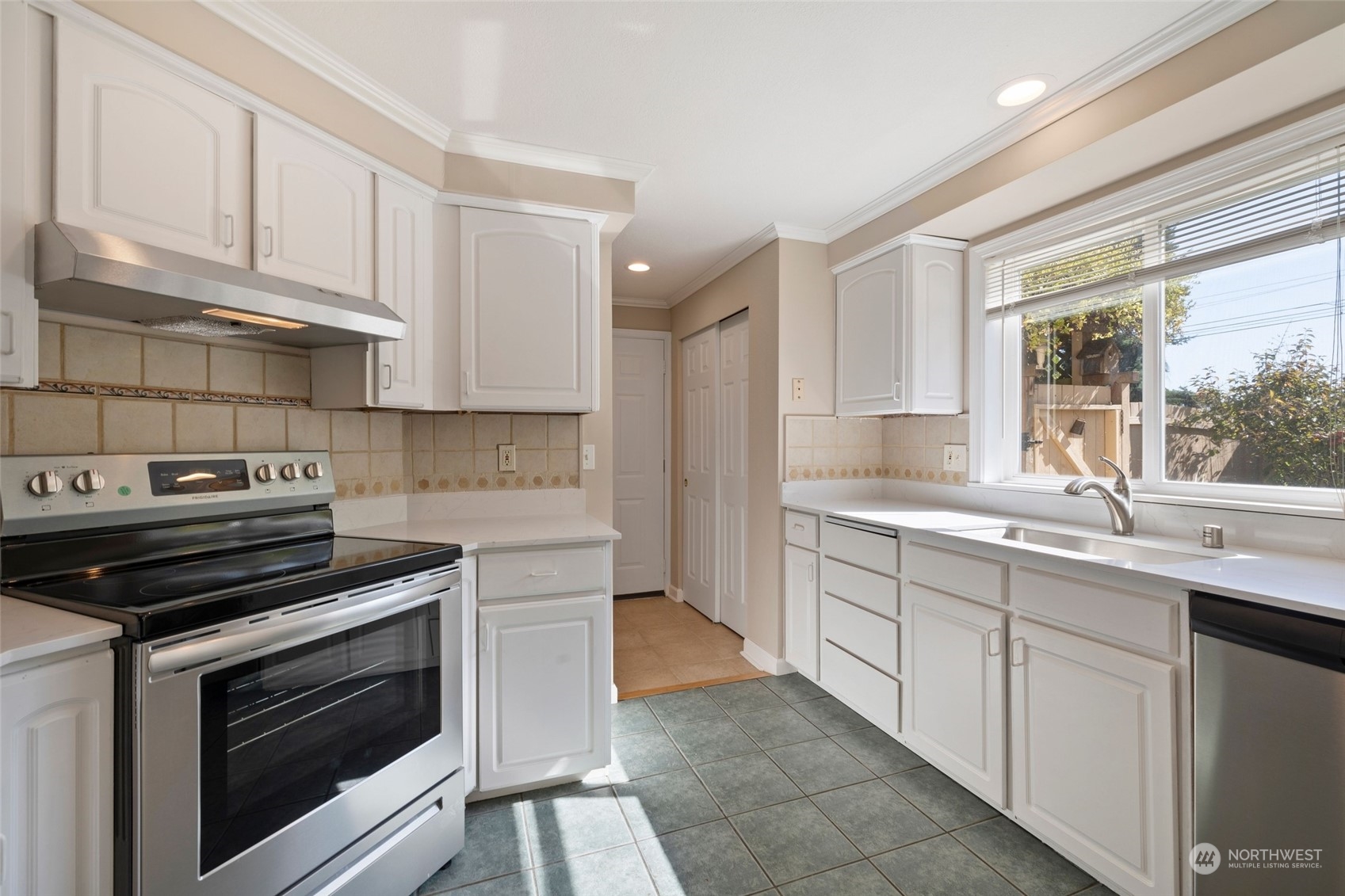 1506 227th Place Southwest Bothell, WA 98021 - Photo 6 of 25 a kitchen with cabinets appliances and a window