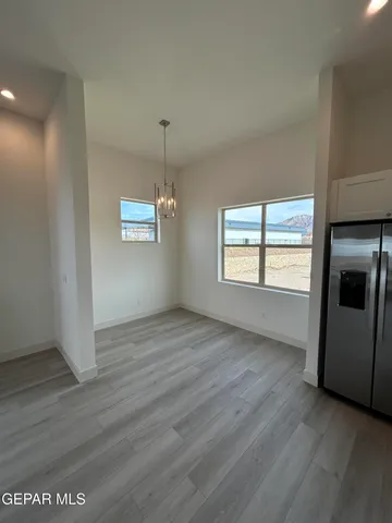 a kitchen with a sink a stove and cabinets