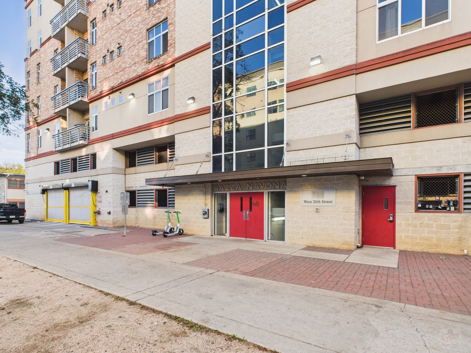 711 West 26th Street, Unit 606 Austin, TX 78705 - Photo 11 of 11 a front view of a building with an outdoor space