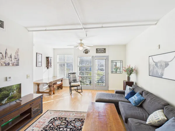 a living room with furniture and a flat screen tv
